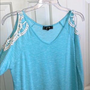 Flowy blue top with shoulder cutouts